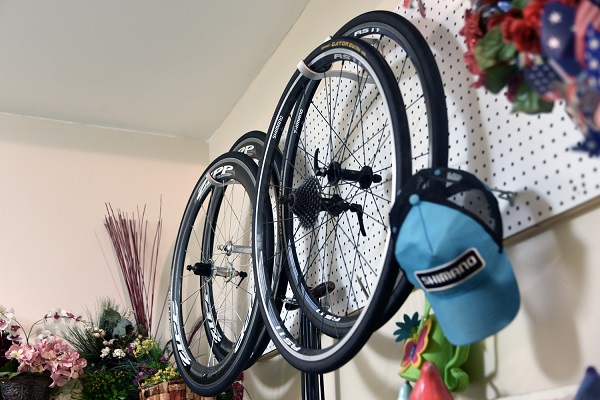 Is it OK to hang a bike by the wheel