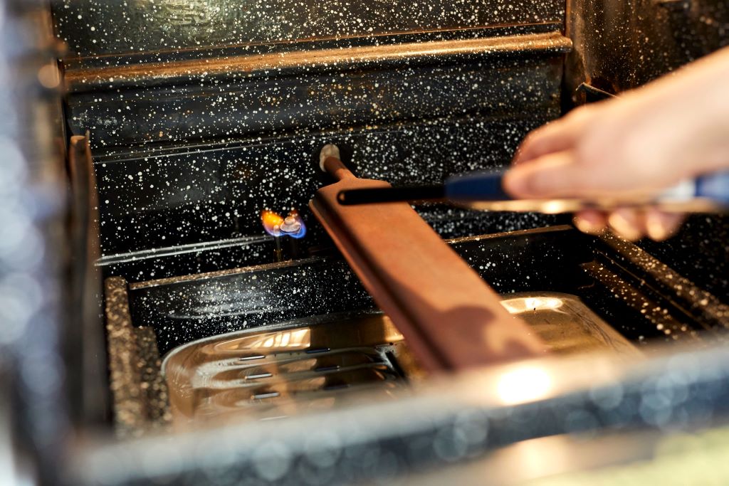 How do you relight the pilot light on a gas oven